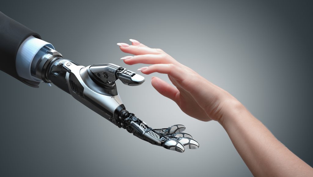 robotic hand reaching for human hand