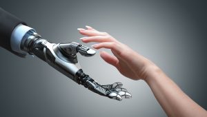 robotic hand reaching for human hand